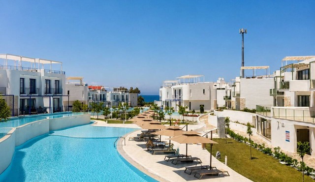 Modern penthouse apartment with ocean views and a pool in Lapta