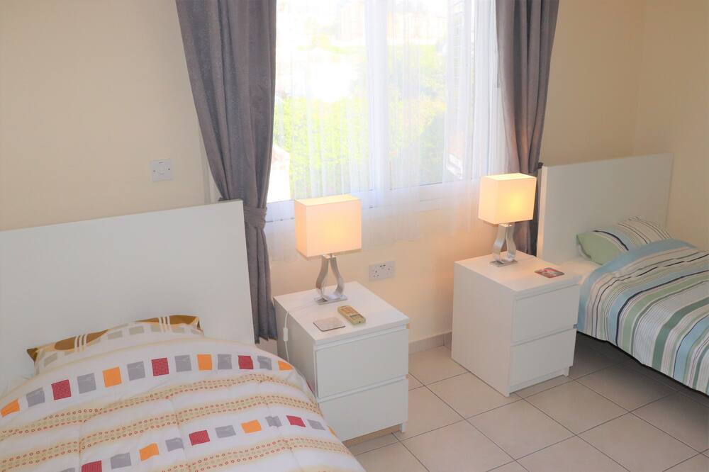 Peyia Town House | Direct access to the pool from the garden. A sandy beach is a few minutes away.