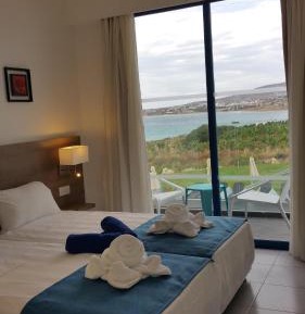 One-Bedroom Suite with Sea and Pool View