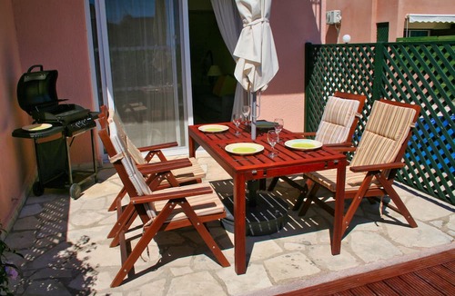 Peyia Town House | Direct access to the pool from the garden. A sandy beach is a few minutes away.