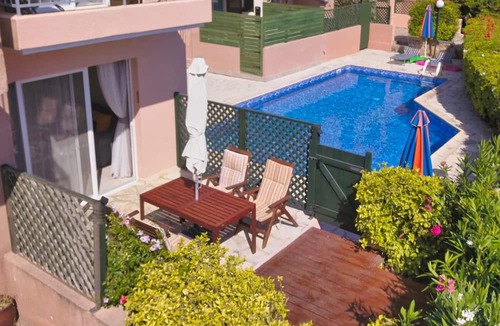 Peyia Town House | Direct access to the pool from the garden. A sandy beach is a few minutes away.