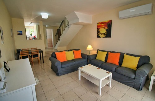 Peyia Town House | Direct access to the pool from the garden. A sandy beach is a few minutes away.