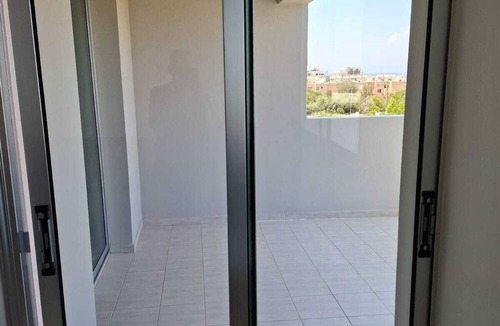 Kapparis Apartment | Top floor apartmenT with community pool and sea views