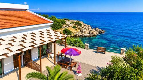 Karavas Hotel | Sea & Sky Seafront Bungalows at Escape Beach