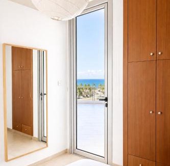 Larnaca Apartment | Relaxing Sea View & Sunrise from your Bed, 2-BDR Apt in tallest building in Larnaca - 3 min walk to Beach, by Blue Palm Living