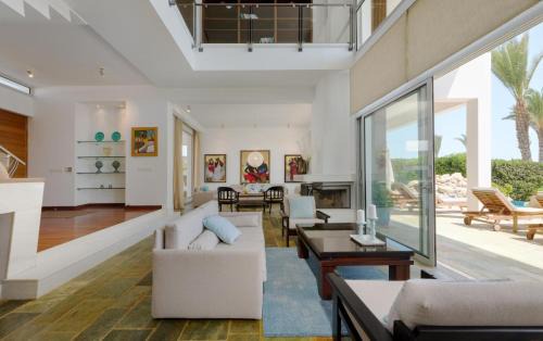 Pegeia Villa | Seafront Villa Kyma by Ezoria Villas